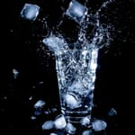 indoor photoshoot idea ice splashing in a glass of water