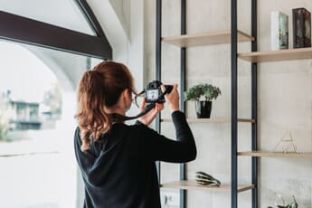 Woman composing a photograph