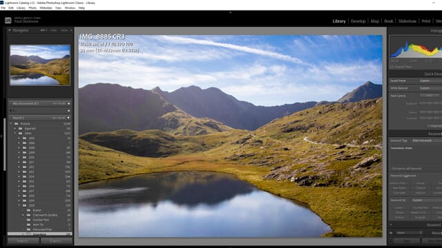Lightroom Classic Library module displaying a photo of Snowdonia mountains with a lake and blue skies.