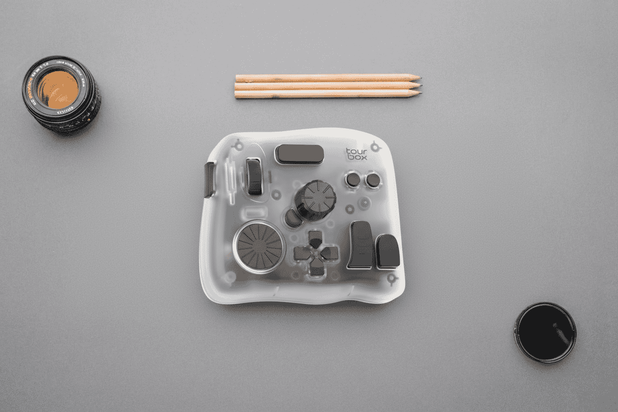 Controller for photo and video shown with a camera lens and pencils.