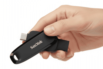 Hand holds SanDisk photo stick