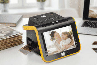 A Kodak digital film scanner displays a vibrant image while digitizing 35mm film negatives, ideal for preserving old photo memories in high resolution.