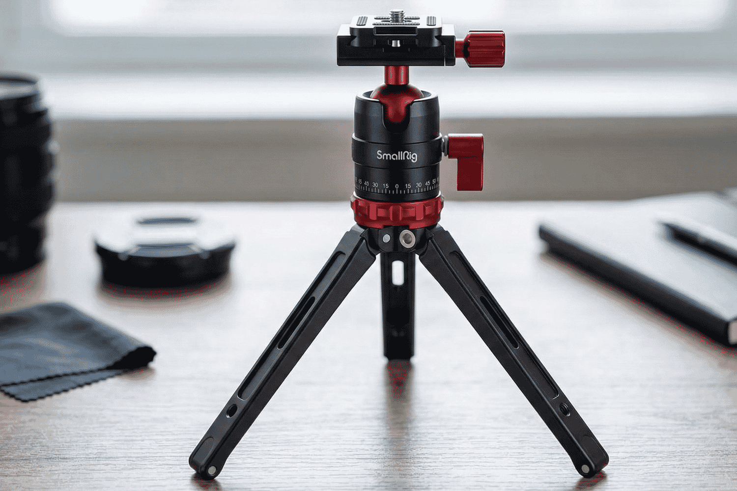 Compact and durable SmallRig tabletop tripod with ball head and red adjustment knobs, ideal for DSLR cameras and desktop photography setups.