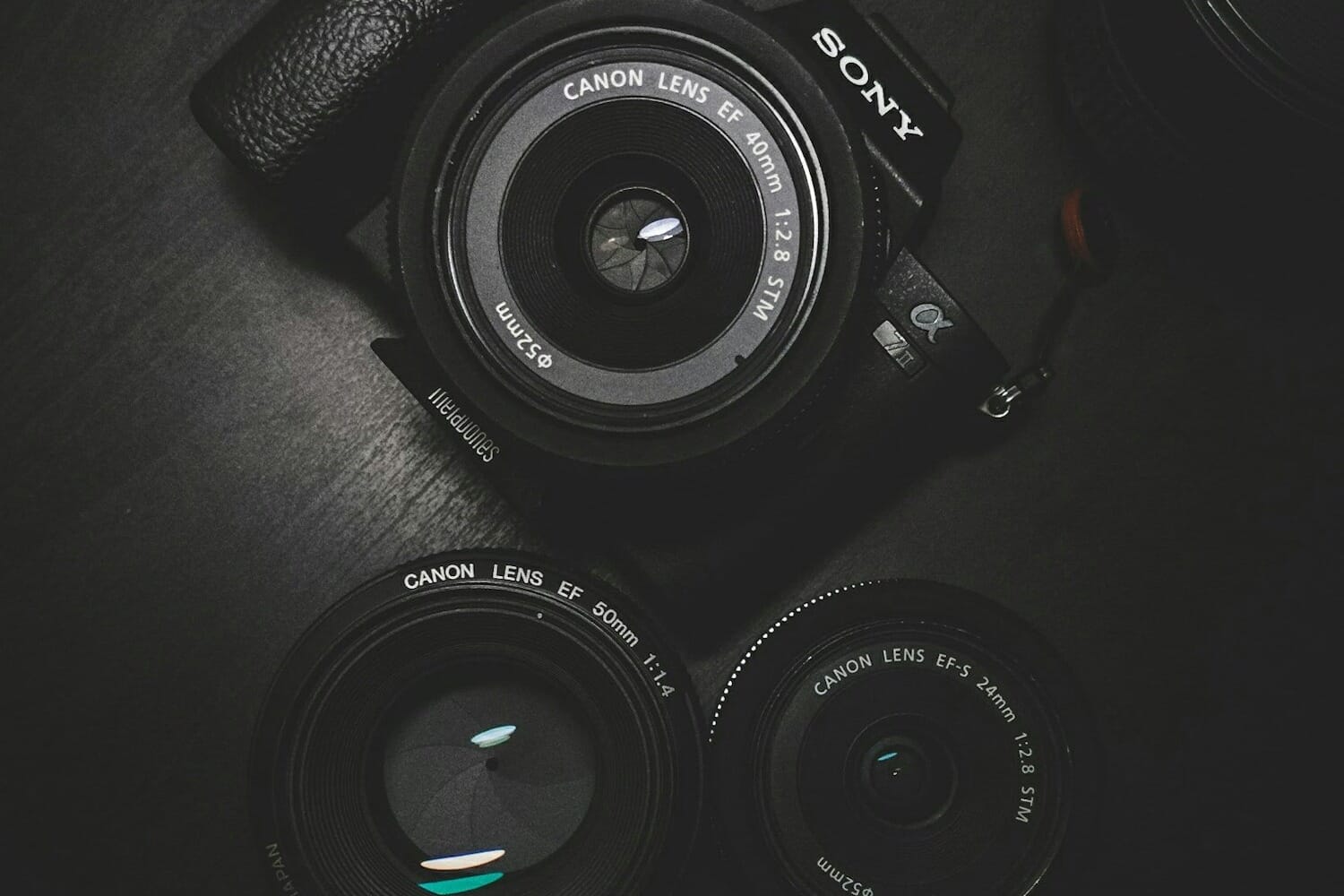 Camera on glass surface reflecting creative photography - breaking photography rules