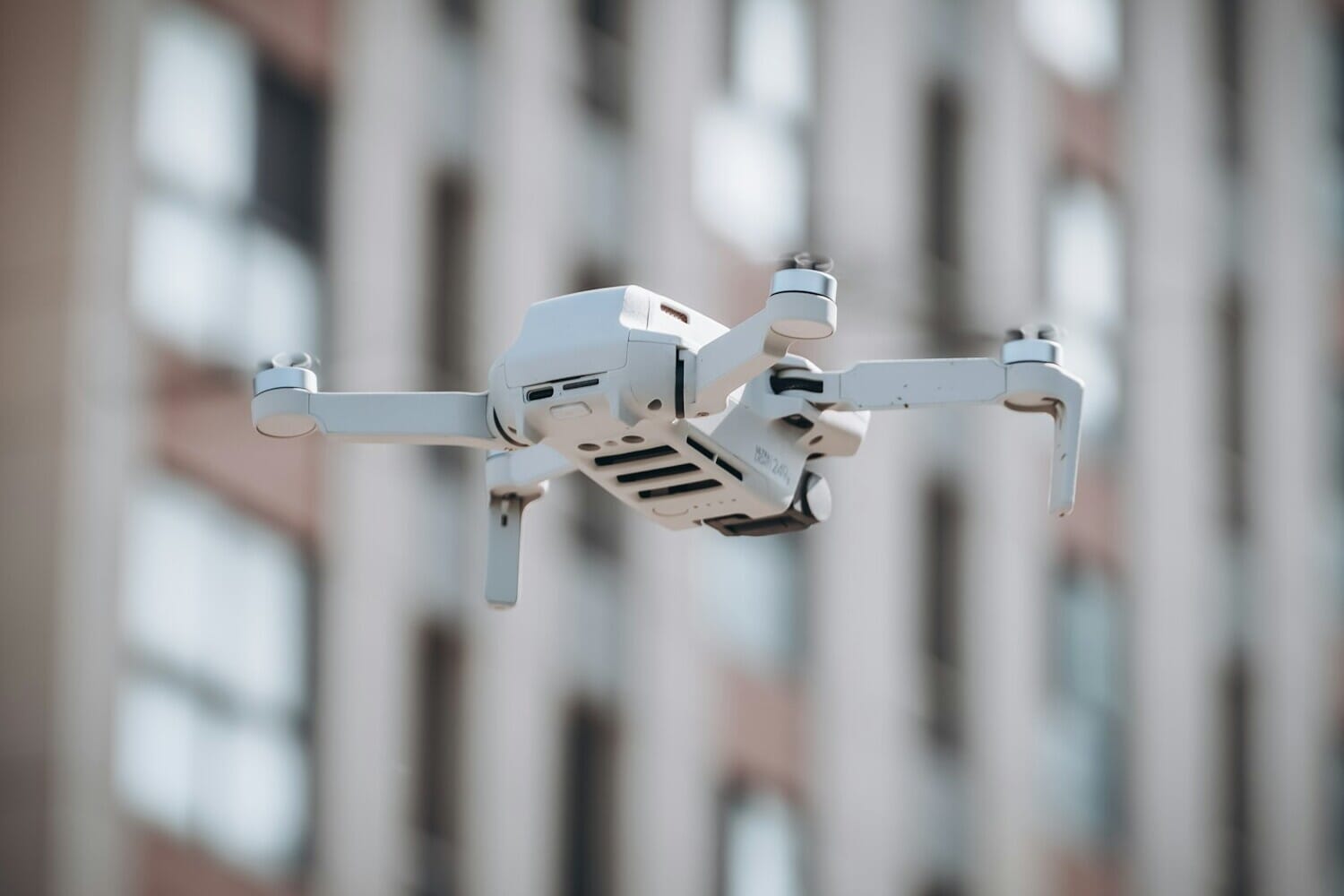 DJI drone flying in the sky - DJI sues FCC over US drone import ban