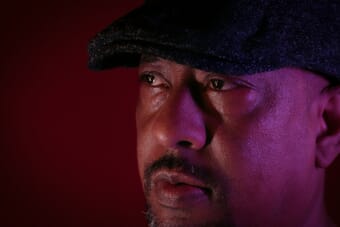 Dramatic portrait lit with colored flash lighting demonstrating high-speed sync flash technique