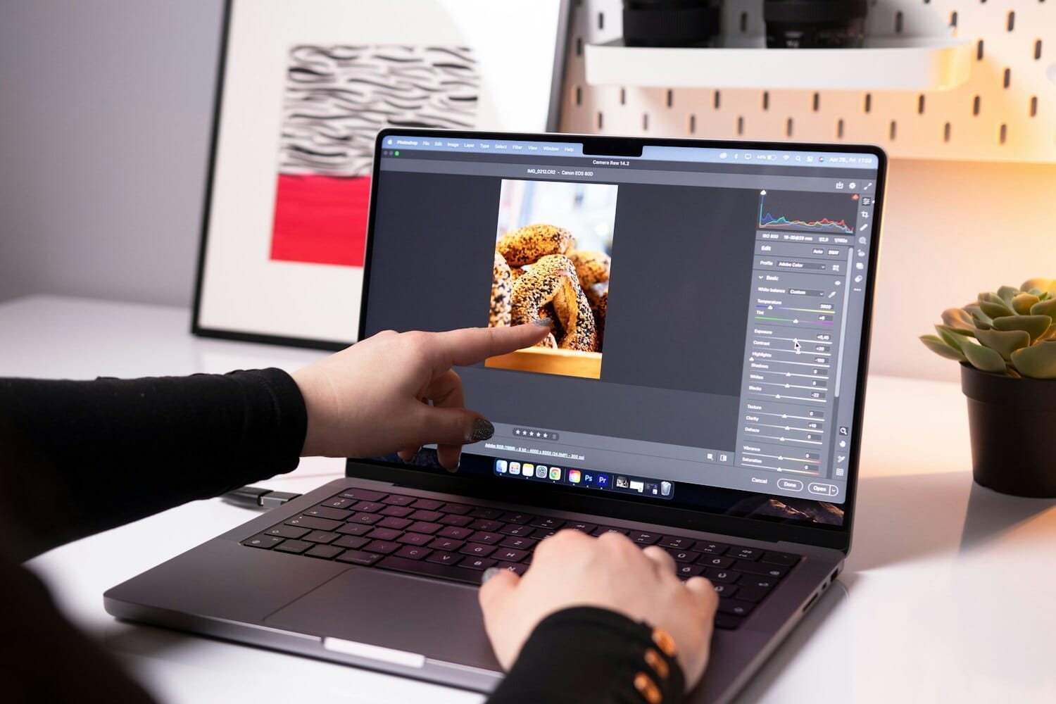Person editing photos on a laptop computer