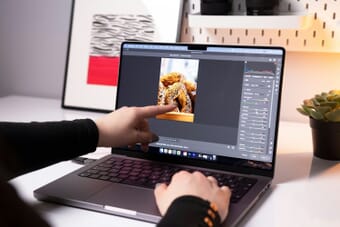 Person editing photos on a laptop computer