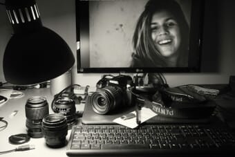 Photo editing workspace with monitor and DSLR camera - ON1 Photo RAW review