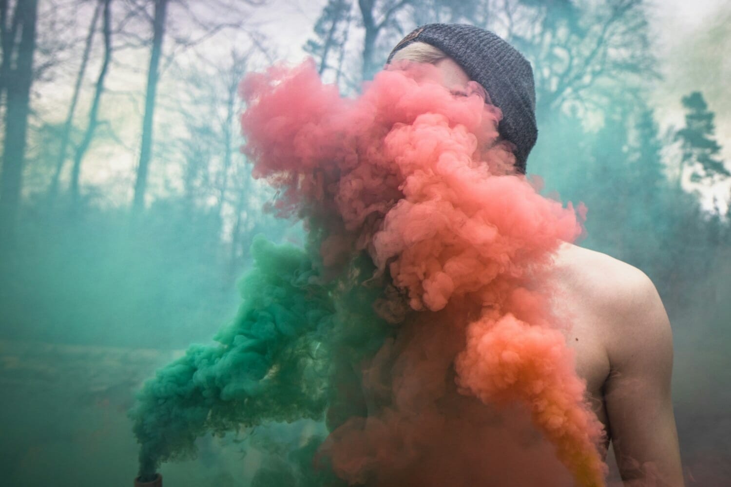 Creative portrait photography with colorful smoke as a prop
