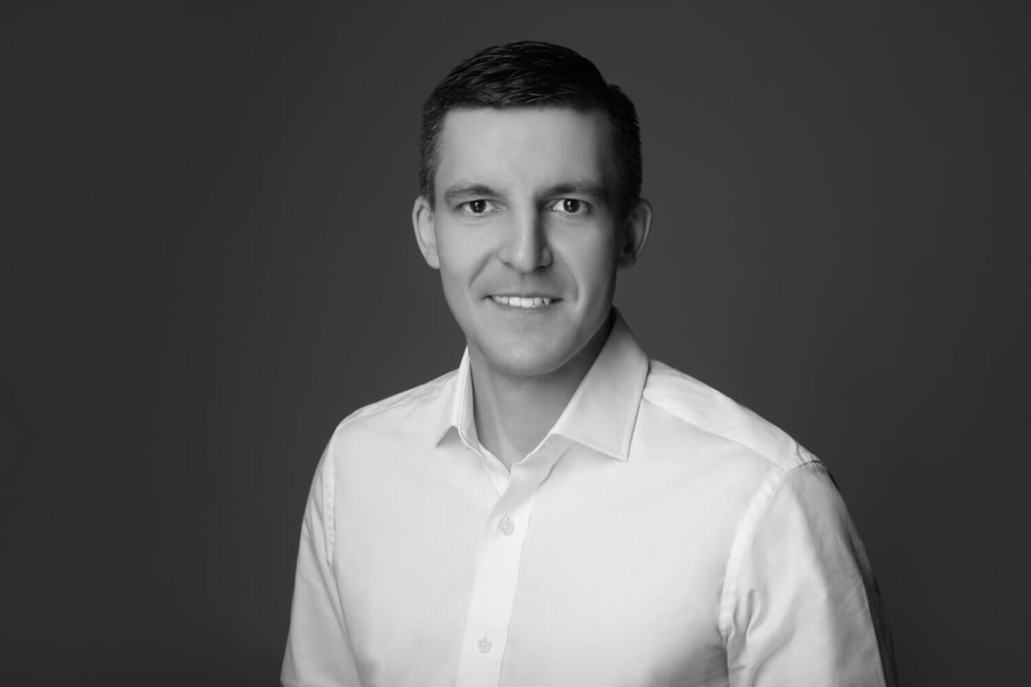 Professional headshot portrait representing the AI vs real photography debate in hiring