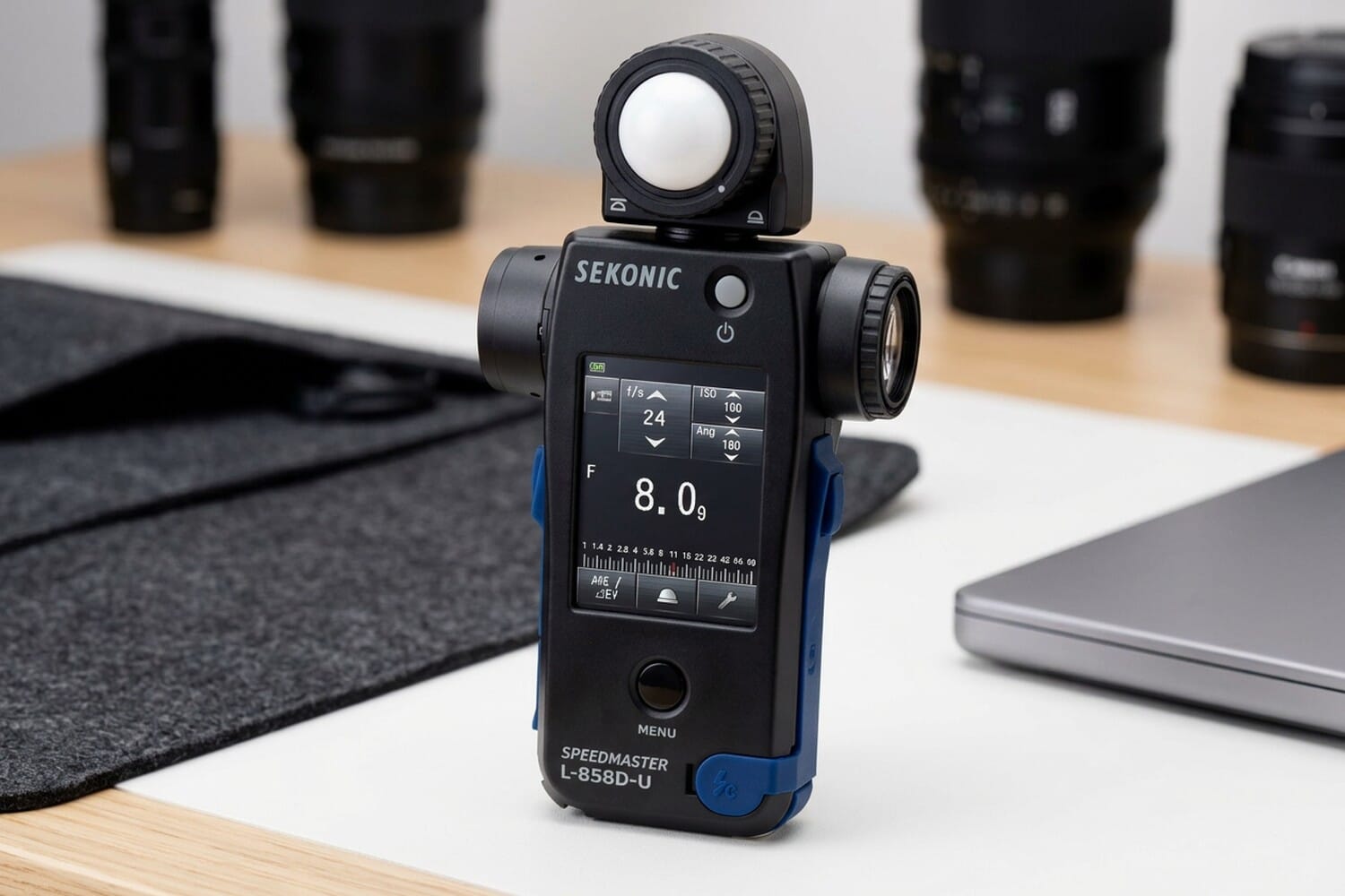 Sekonic Speedmaster L-858D-U light meter on a professional photography desk