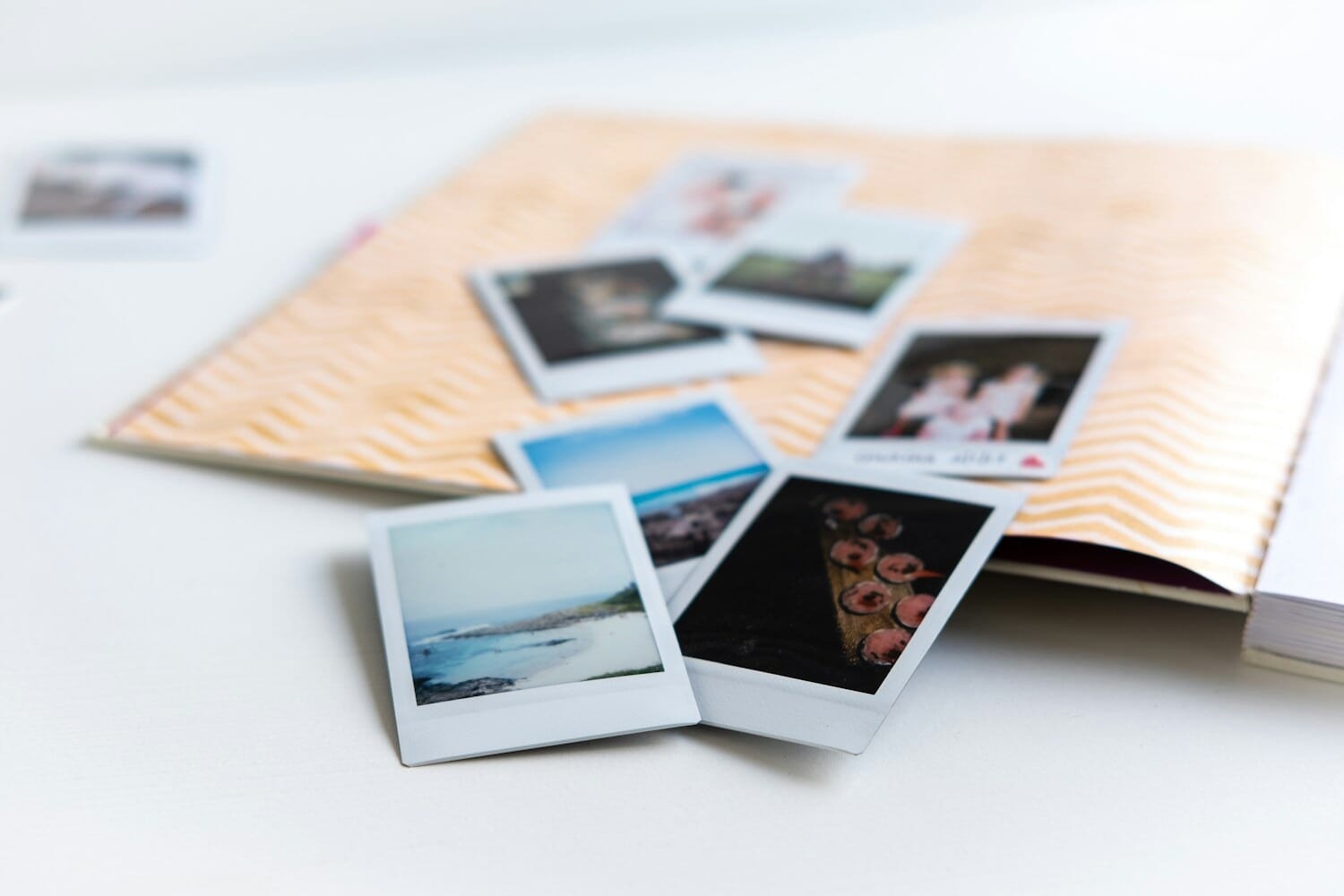 Photo books and printed memories spread on a white table