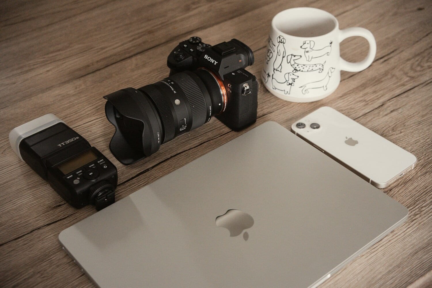 Best stock photography sites - camera, laptop, and creative tools on a workspace