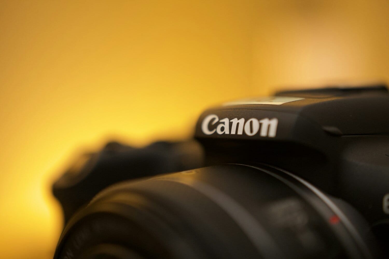 Canon camera close-up showing the Canon logo — Canon EOS R7 firmware v1.8.0 update