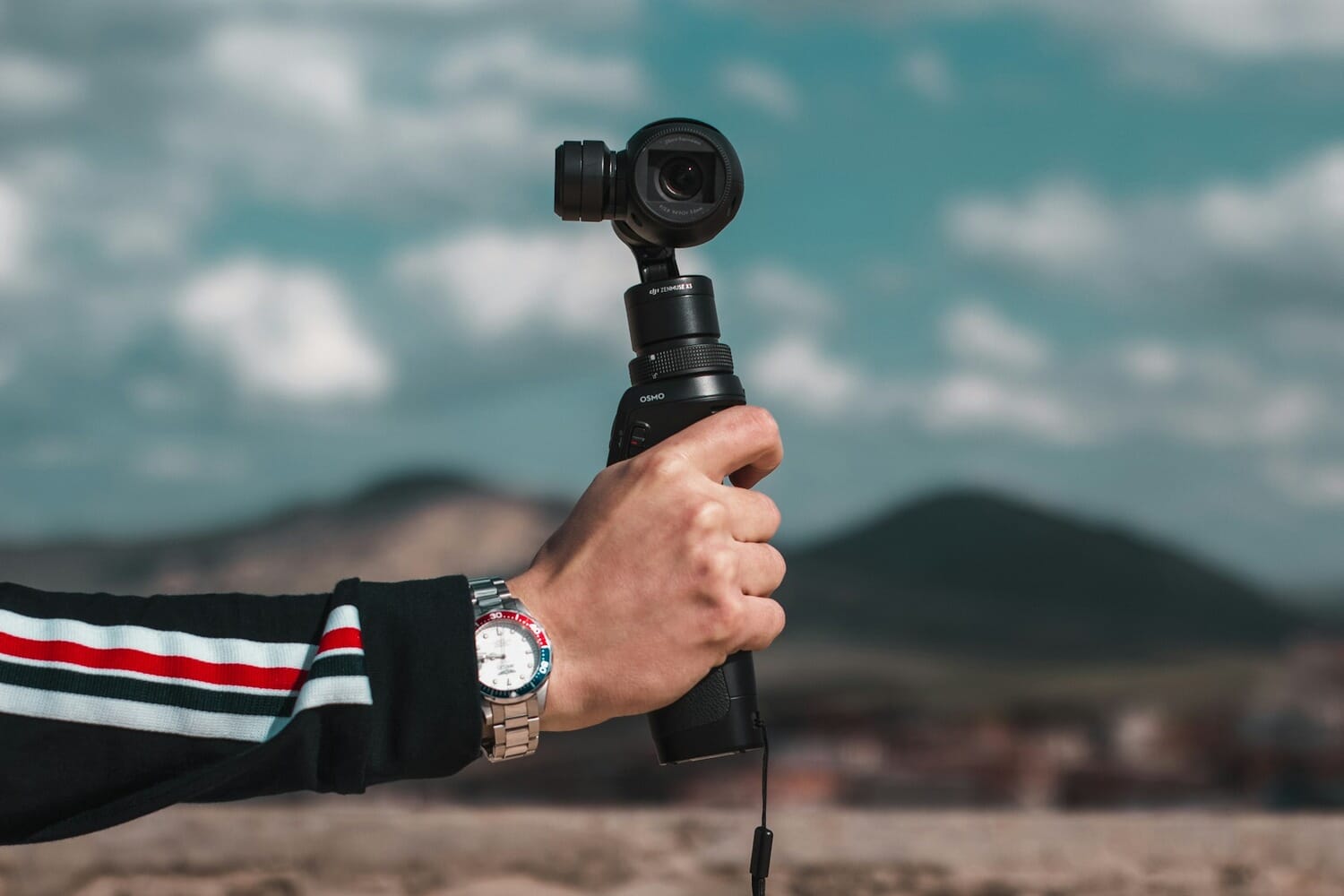 DJI Osmo Pocket gimbal camera held in hand