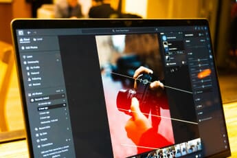 Photo editing software displaying image metadata on a laptop screen