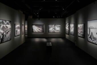 Black and white photography gallery with framed photographs on the wall