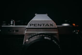 Pentax DSLR camera on a table
