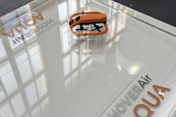 HoverAir Aqua waterproof self-flying camera drone floating on water at IFA 2026